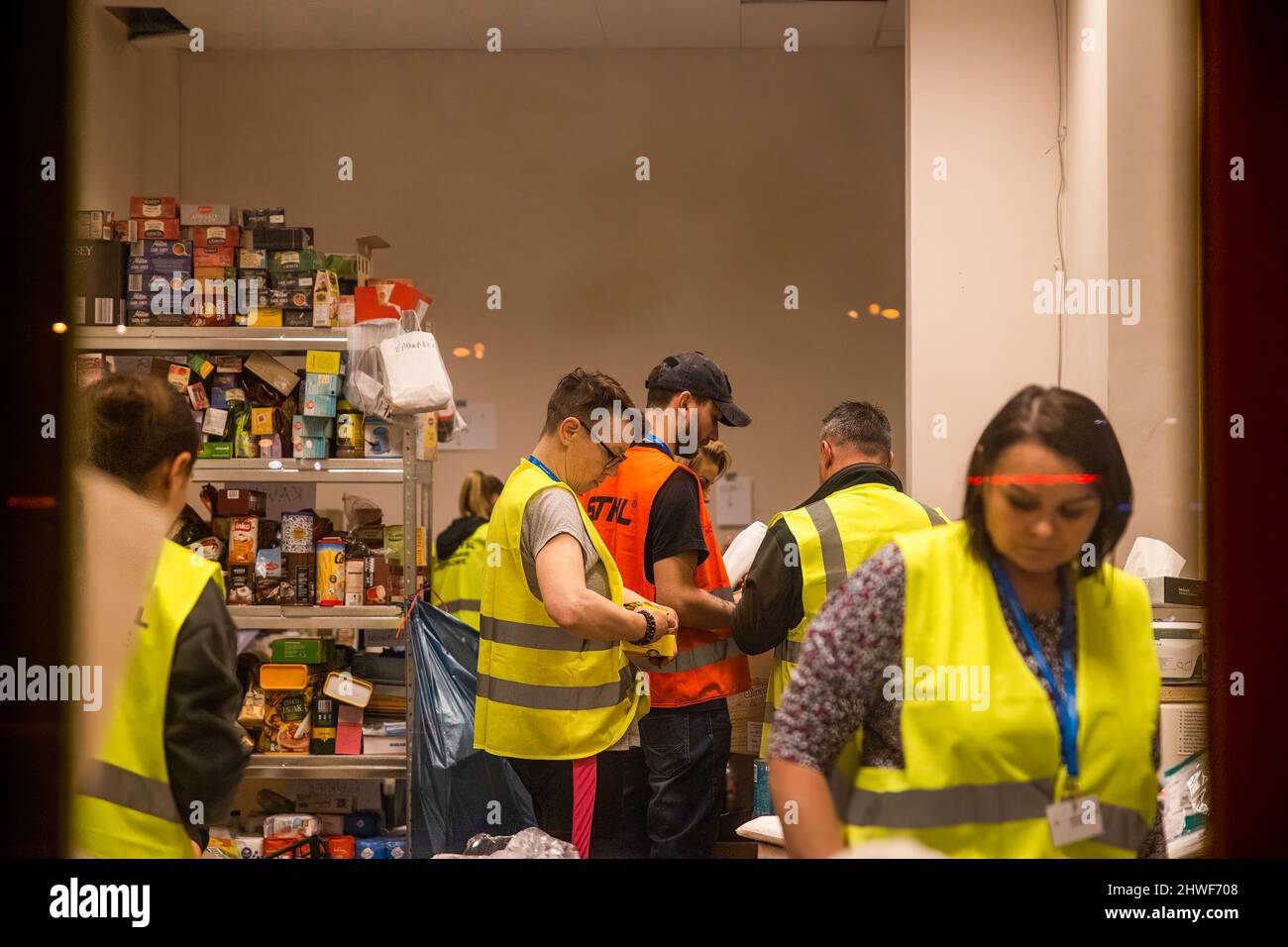 Przemysl, Poland. 05th Mar, 2022. Volunteer hub at the train station through the glass window. Hundreds of thousands of refugees from Ukraine are continuing to arrive at the Polish border town of Przemysl on the 10th day of the Russian Invasion. Credit: SOPA Images Limited/Alamy Live News Stock Photo