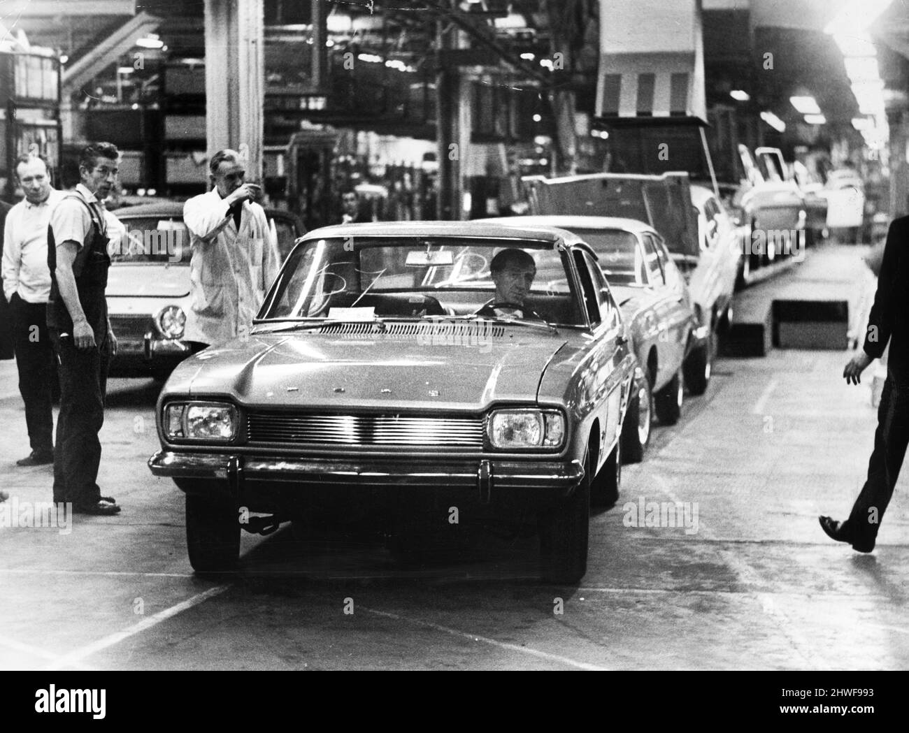 A new Ford Capri car rolls off the production line at the Ford Motor plant in Halewood, Merseyside. January 1969. Stock Photo