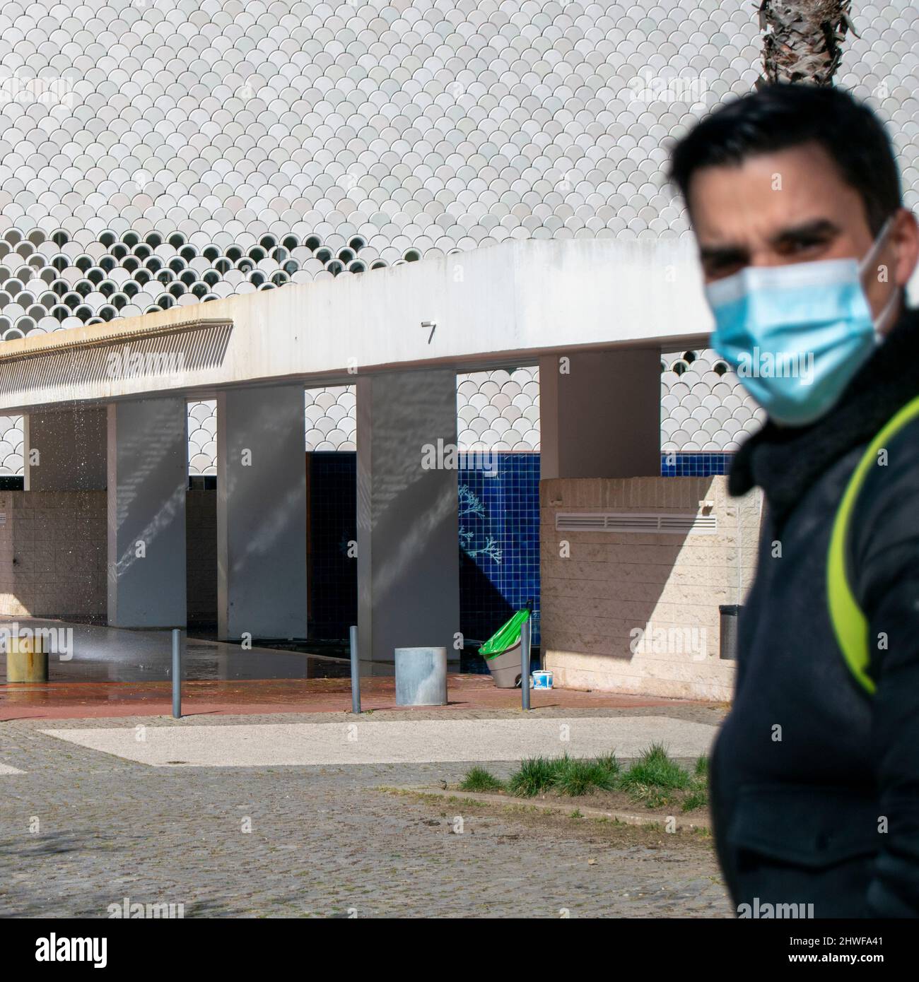 Covid times tourism. Young male using a covid19 mask in lisbon. Stock Photo