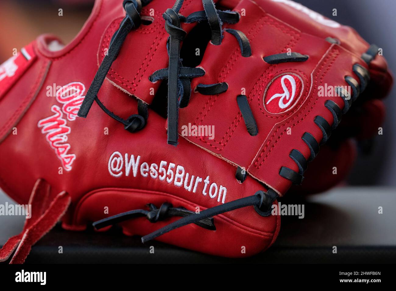MARCH 05, 2022: Ole Miss Pitcher Wes Burton (#55) displays his twitter  handle on his glove. University of Central Florida defeated Ole Miss  Baseball 1-0 at John Euliano Park in Orlando, Florida.