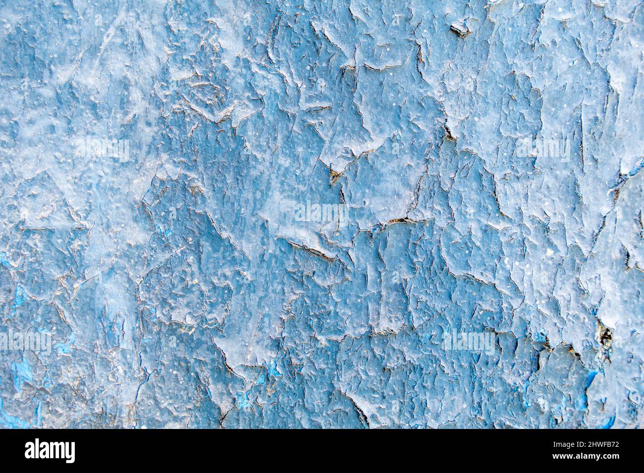Blue paintwork peeled on an old wall with paint weathered Stock Photo