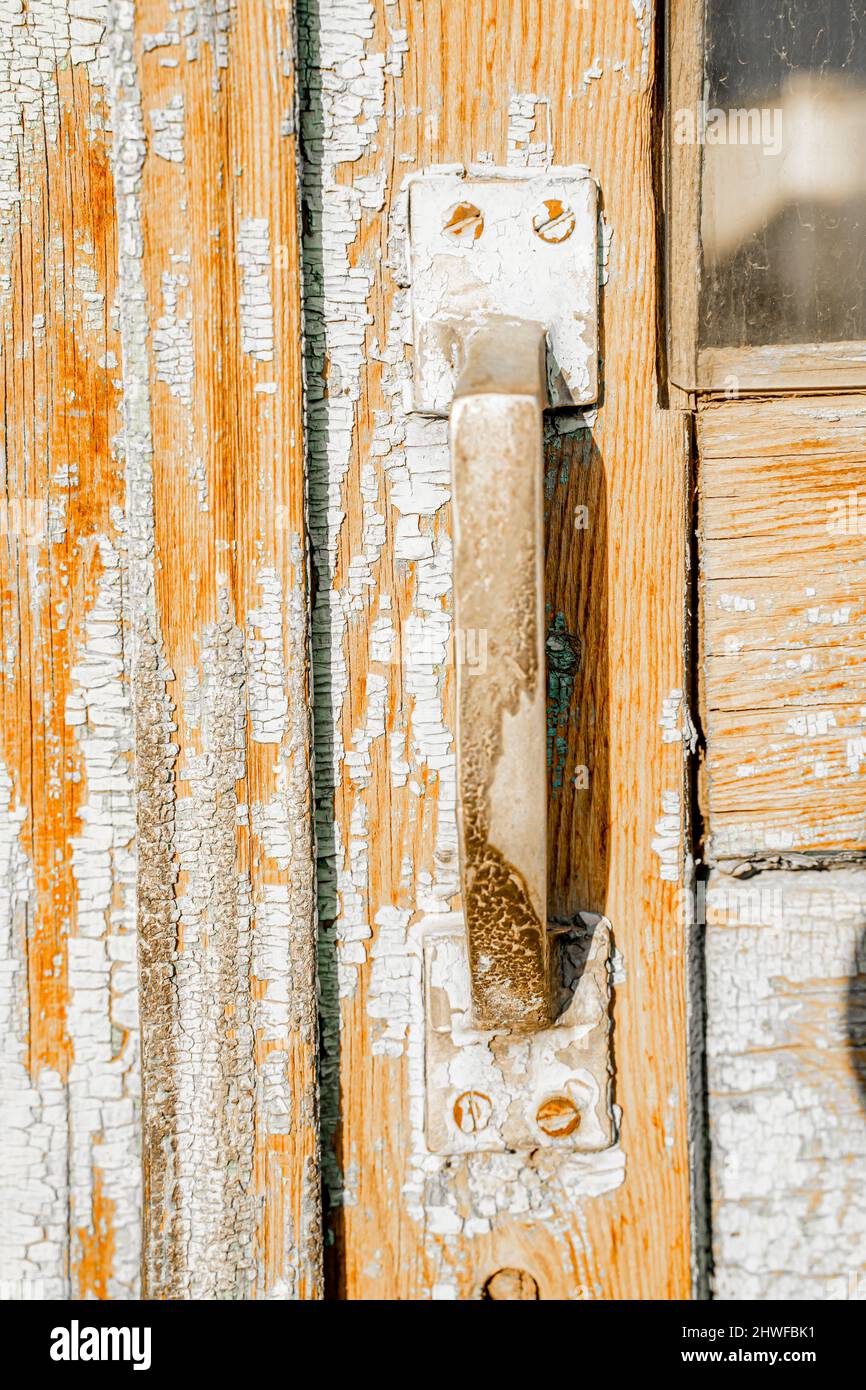 Typical soviet simple door handle on barn door. Stock Photo