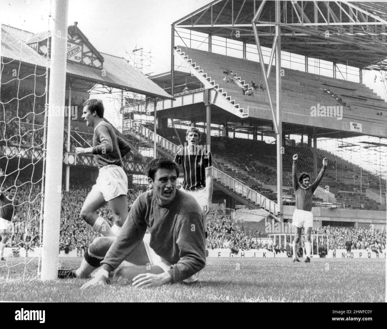 Everton v Crystal Palace league match at Goodison Park August 1969.  Palace keeper John Jackson shouts at his defence as a high cross frm Johnny Morrisey drops into the net for Everton's first goal, John Hurst and Joe Royle celebrate.  Final score: Everton 2-1 Crystal Palace Stock Photo