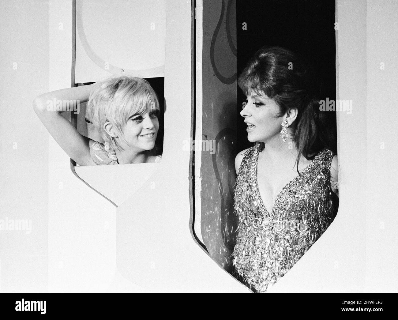 Rowan & Martin's Laugh-In, an American sketch comedy television program on the NBC television network, behind the scenes filming for series 2 episode 22, (aired Monday 3rd March 1969), in studio, Wednesday 15th January 1969. Our picture shows ... Goldie Hawn and Gina Lollobrigida, Joke Wall. Stock Photo