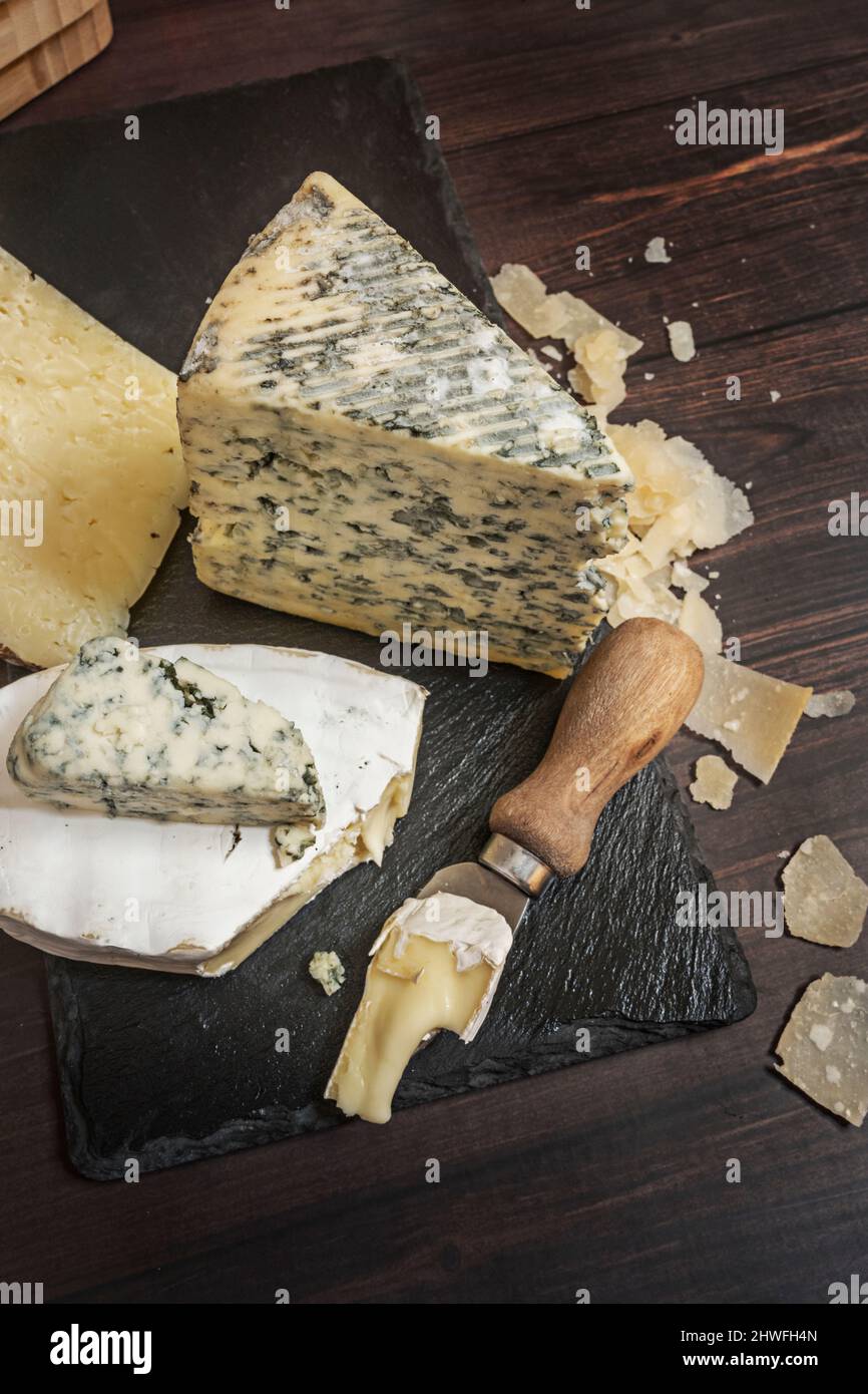 Blue cheese, especially cow's milk, soft cheese, with a strong taste and smell that has characteristic blue-green streaks produced by the type of fung Stock Photo