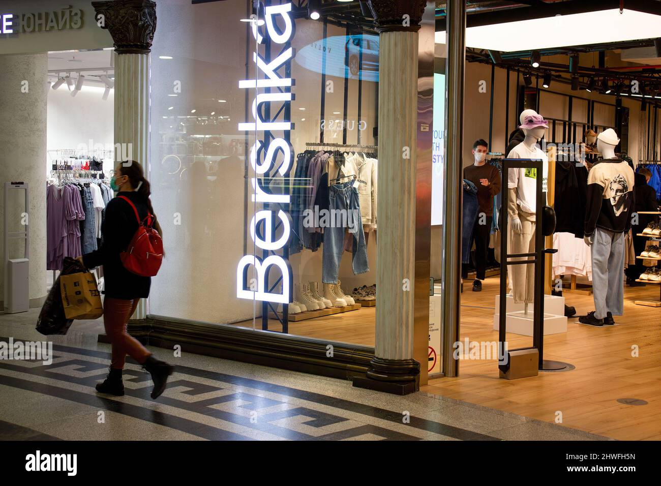 Moscow, Russia. 05th Mar, 2022. A woman passes by Bershka boutique in  Moscow. The Spanish fashion retailer Inditex, which owns such brands as Zara,  Bershka, Pull&Bear, Massimo Dutti, Stradivarius, and others, announced