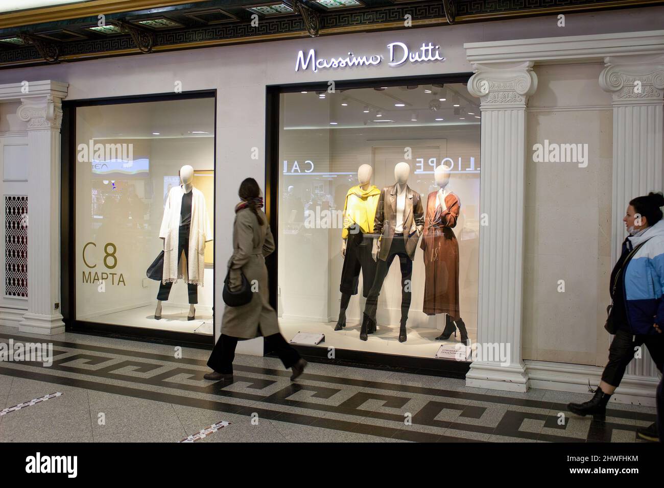 Moscow, Russia. 05th Mar, 2022. A woman passes by Massimo Dutti boutique in  Moscow. The Spanish fashion retailer Inditex, which owns such brands as  Zara, Bershka, Pull&Bear, Massimo Dutti, Stradivarius, and others,