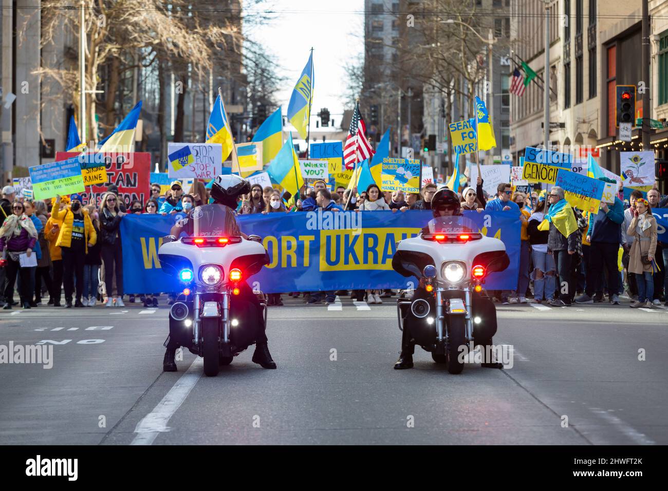 Seattle, Washington, USA. 5th March, 2022. Members of the Seattle Police  Department escort supporters along 4th Avenue during a rally against the  Russian invasion of Ukraine. Hundreds attended the “Ukrainian March and