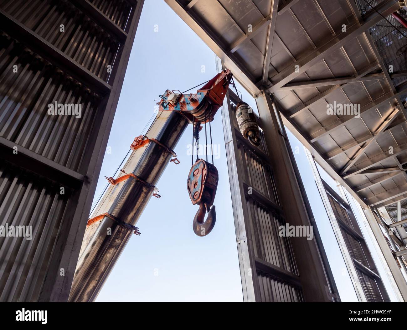 Hoist of crane at the window of industrial plant Stock Photo Alamy