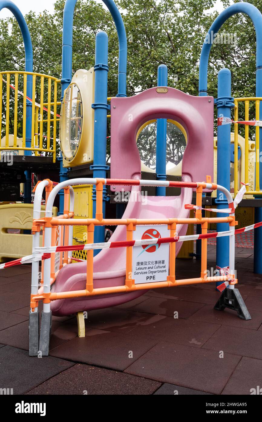 Zero Covid Hong Kong. Omicron.  2022.  Covid social restrictions in Hong Kong forcing public places and recreational facilities  to close due to Omicron. Childrens playground closed. Stock Photo