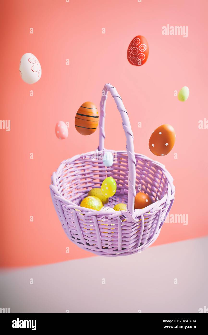 Easter eggs falling into a flying basket, Easter holiday concert Stock Photo