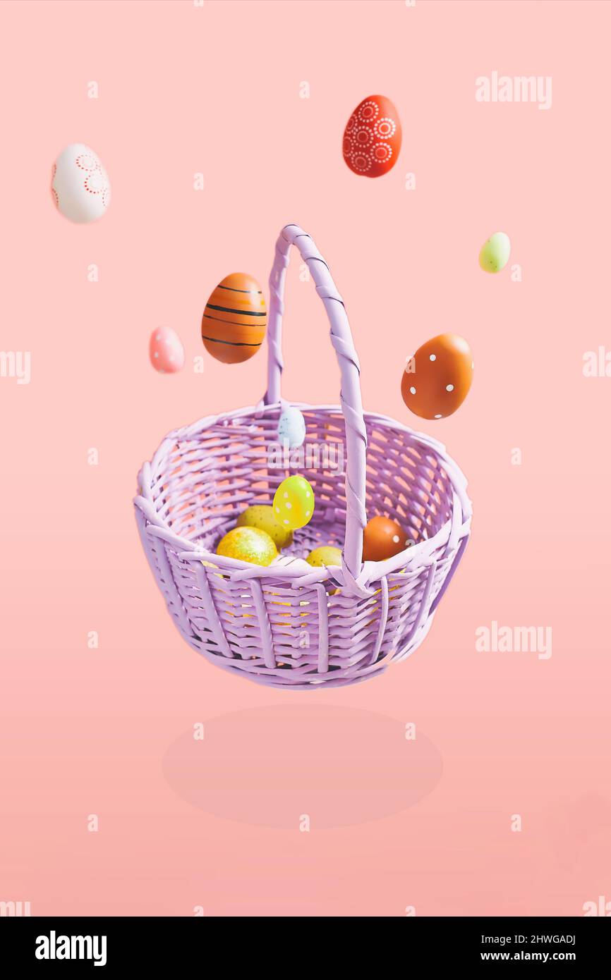 Easter eggs falling into a flying basket, Easter holiday concert Stock Photo