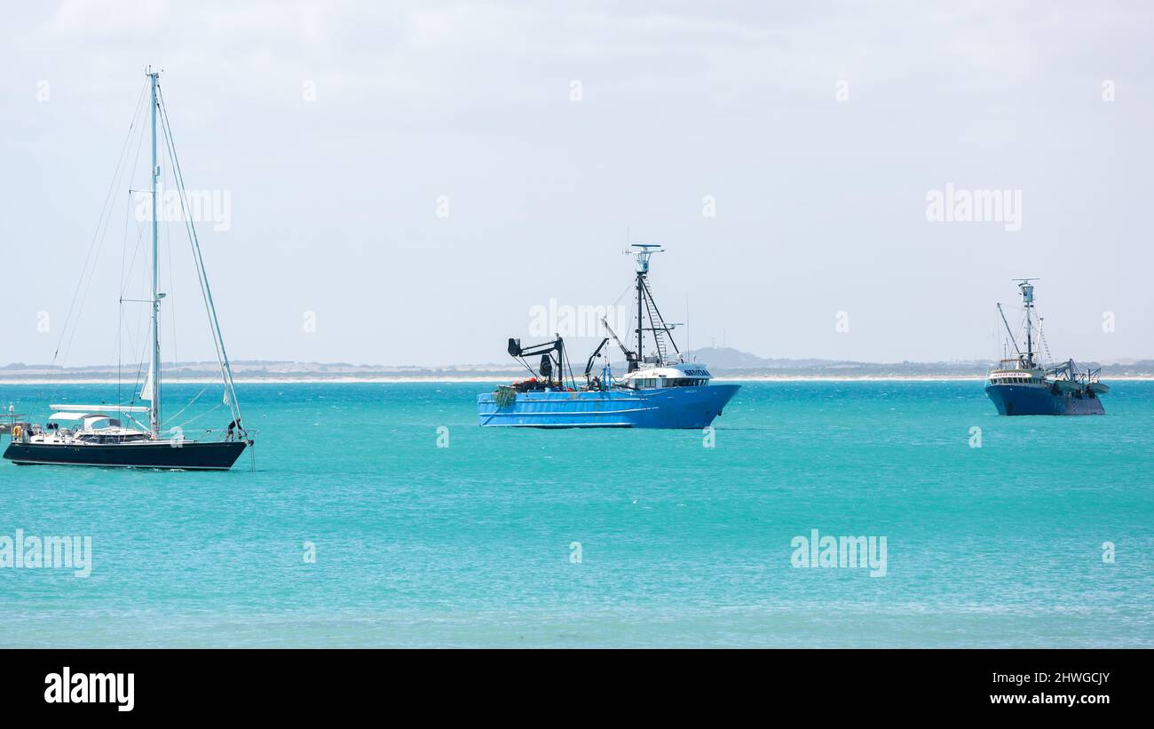 Boats moored in the torquoise waters of Robe in the south east of South Australia taken on February 18th 2022 Stock Photo