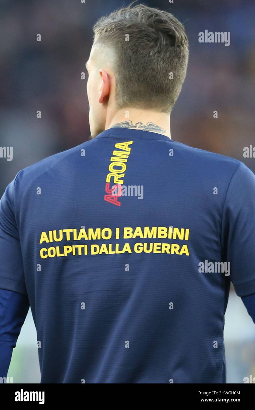 the back of the training jersey with the inscription Let's help the  war-affected children of RomaÕs Italian forward Nicolo Zaniolo during the  Serie A football match between AS Roma and Atalanta at