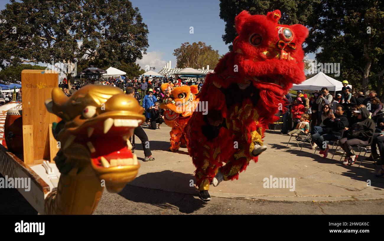 Los Angeles, California, USA. 5th Mar, 2022. People perform lion dance during a dragon boat festival in Los Angeles, California, the United States on March 5, 2022. Hundreds of people gathered in Marina del Rey in southern California Saturday for a Dragon Boat Festival featuring dragon boat racing, a live music show and family gatherings. Nearly 40 teams competed in the dragon boat racing in the harbor, with participants' age ranging from 10 to 70. Many participants were multi-generational families paddling together. Credit: Zeng Hui/Xinhua/Alamy Live News Stock Photo