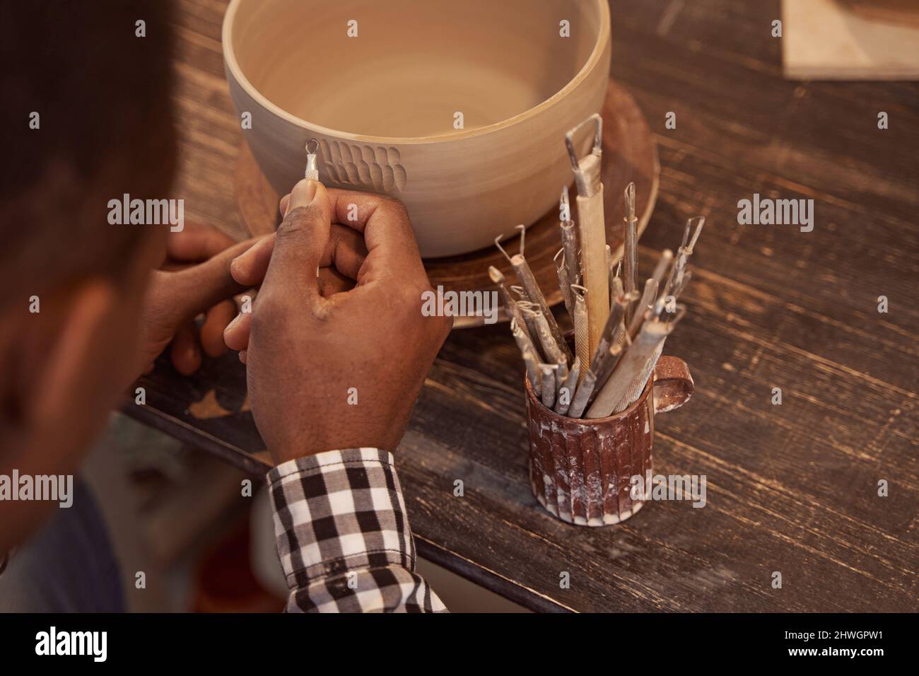 Professional male potter making bowl hi-res stock photography and ...