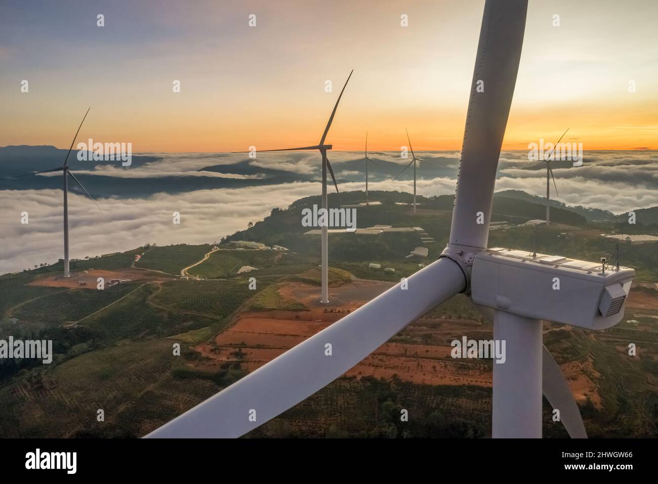 Aerial view of windmill or wind farm in fog  at Cau Dat town, Da Lat city, Lam Dong, Vietnam Stock Photo
