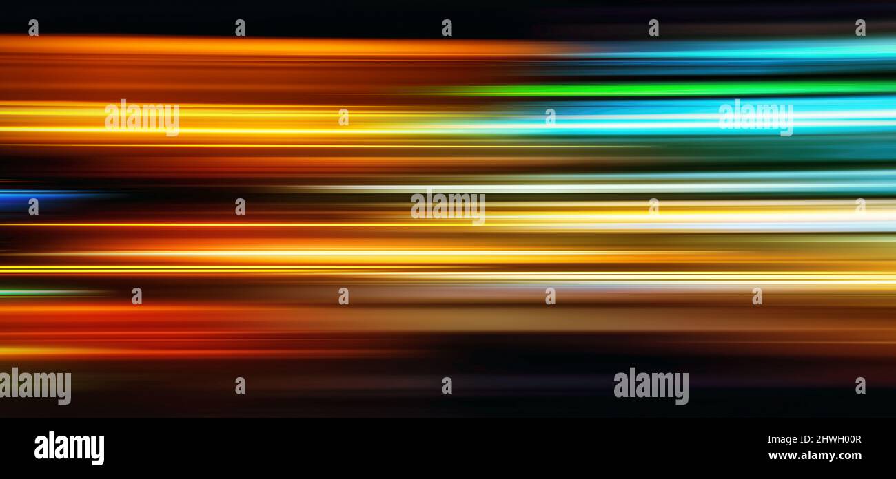 Abstract Rainbow light trails on the dark blue background. Motion blur ...
