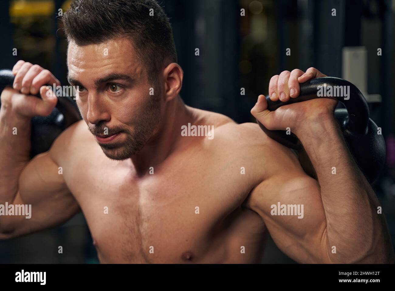 Strong sporty male person lifting heavy weights Stock Photo Alamy