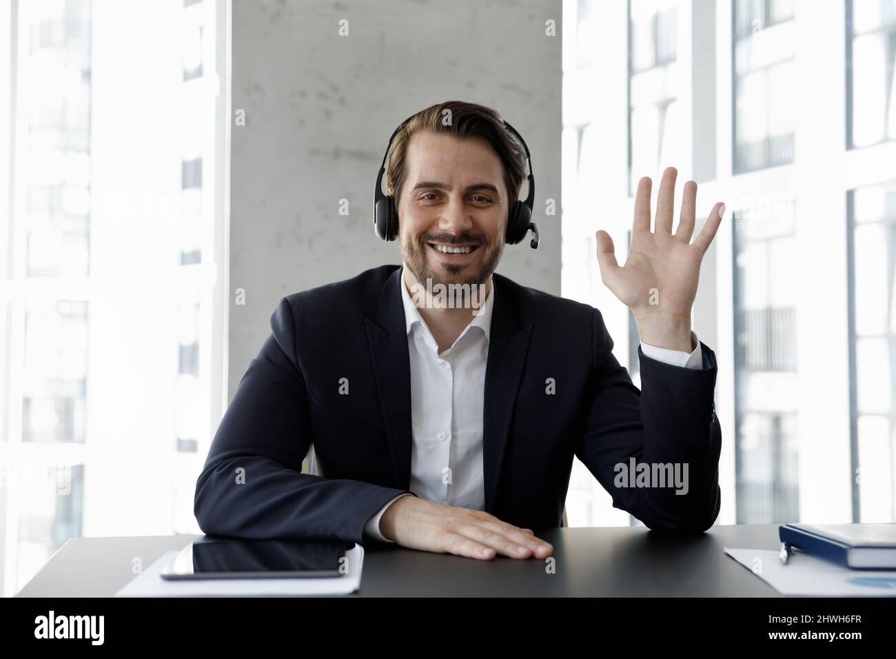 Web camera view smiling young businessman holding video call. Stock Photo