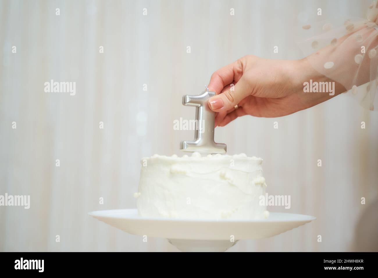 Cake for a one-year-old child with the number one year Stock Photo