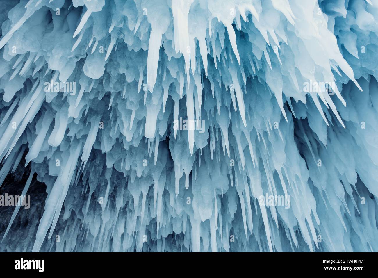 Blue ice and icicles in grotto Stock Photo