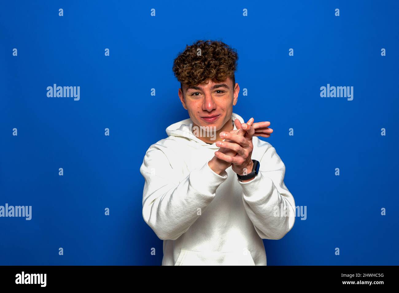 Man curly hair clapping hands hi-res stock photography and images - Alamy