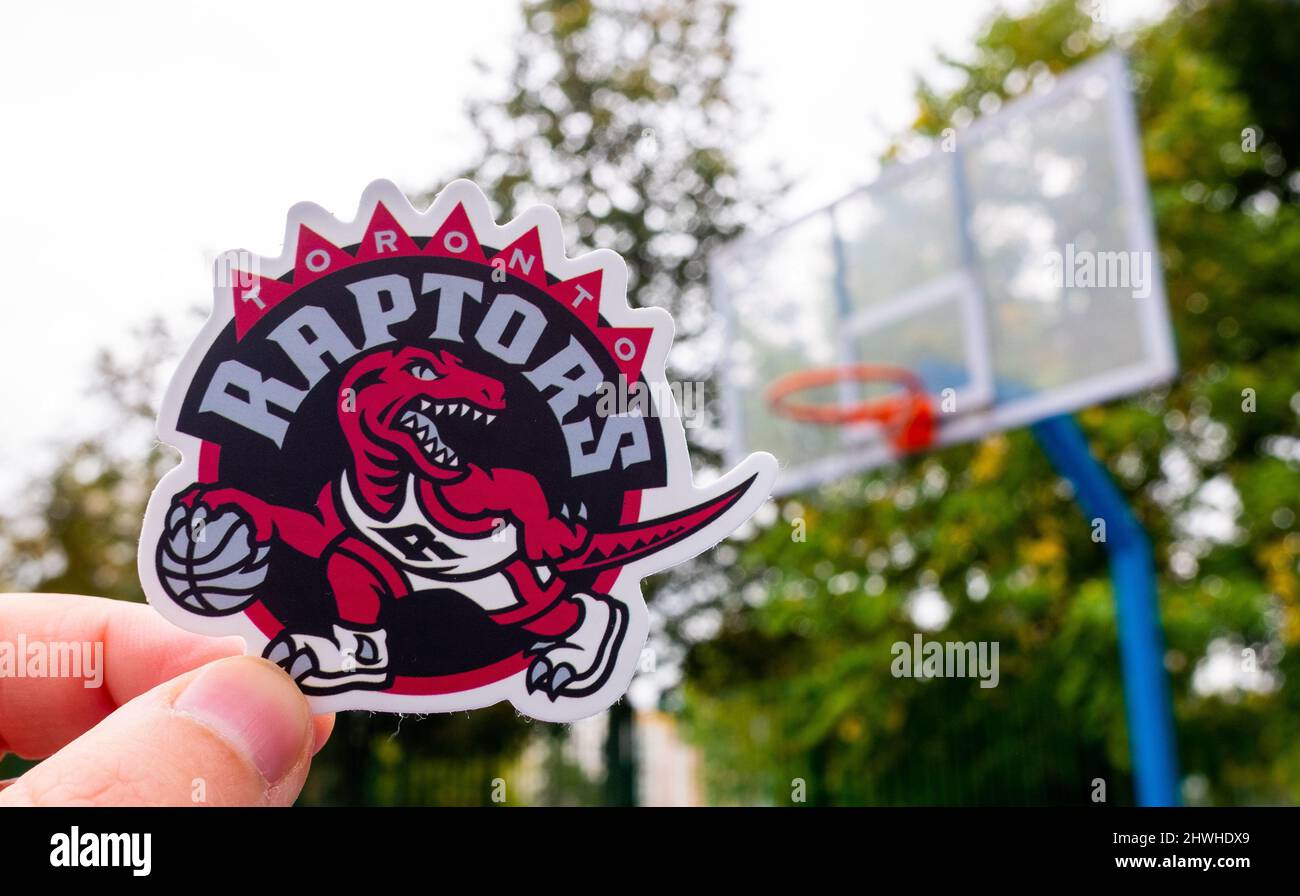 September 15, 2021, Toronto, Canada, A man holds the emblem of the Toronto Raptors basketball club in his hand on the sports field Stock Photo
