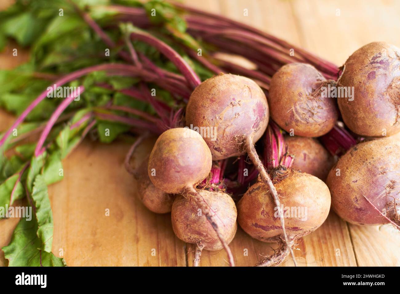 Good eats. Closeup shot a bunch of radishes on a cutting board. Stock Photo