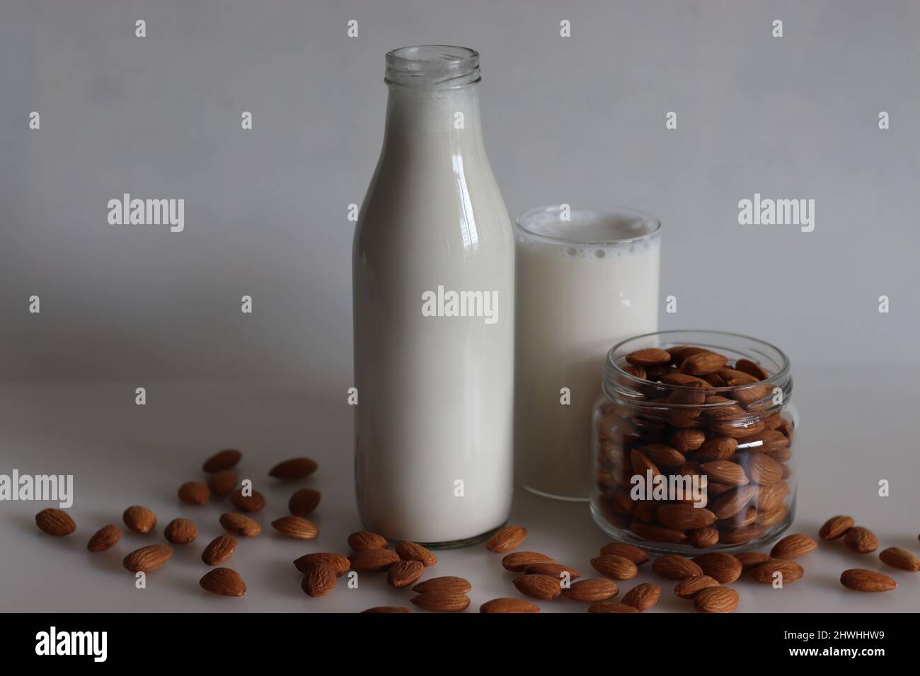 Homemade Almond milk without preservatives. Milk extracted from soaked almonds. Used for smoothies and overnight oats. Shot on white background Stock Photo
