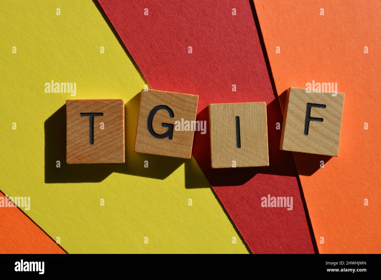 TGIF, abbreviation for Thank God It's Friday, in wooden alphabet letters  isolated on bright and colourful background Stock Photo - Alamy