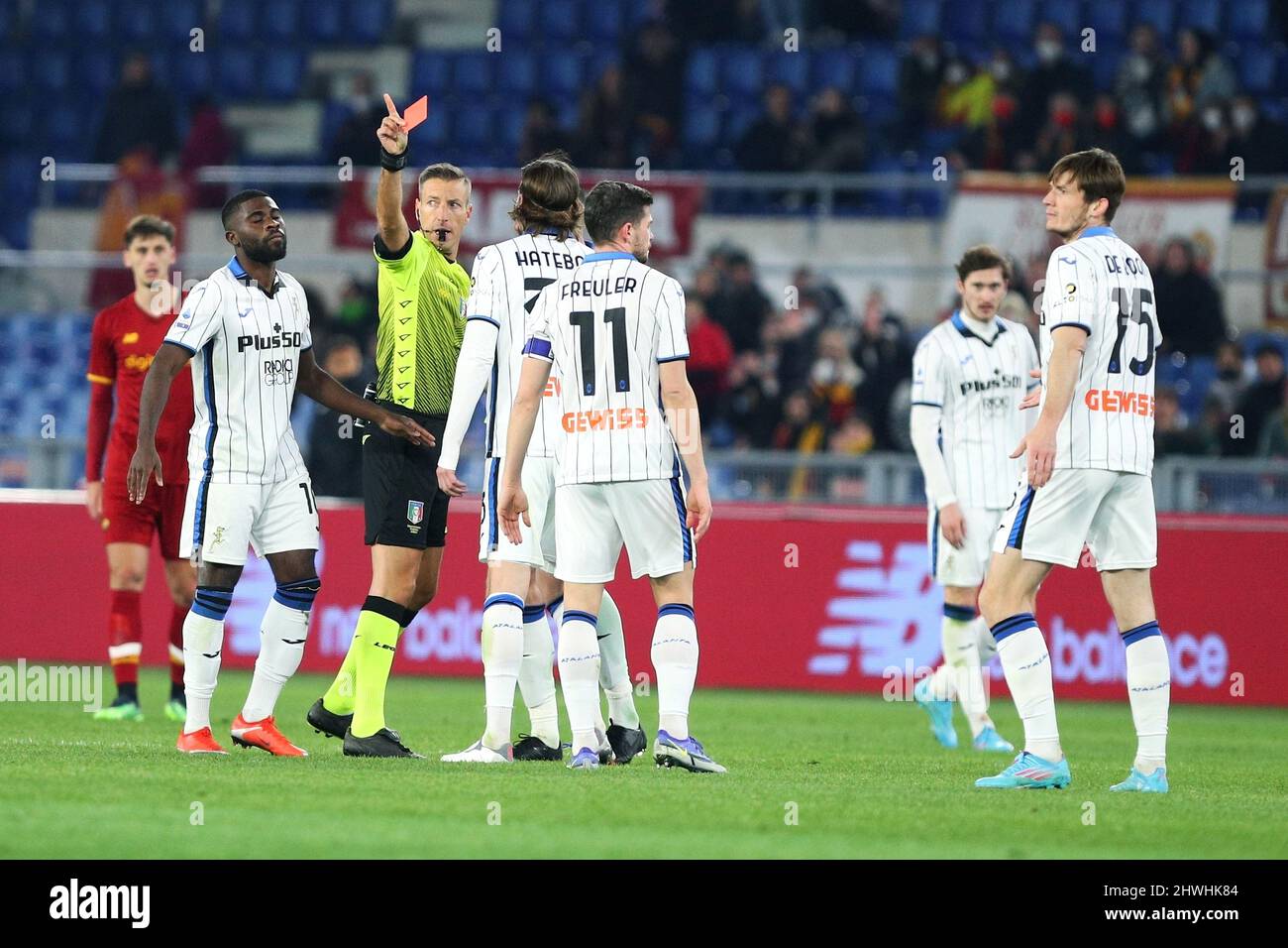 Davide Massa referee shows red card to Marten De Roon of Atalanta (R)  during the Italian championship Serie A football match between AS Roma and  Atalanta BC on March 5, 2022 at