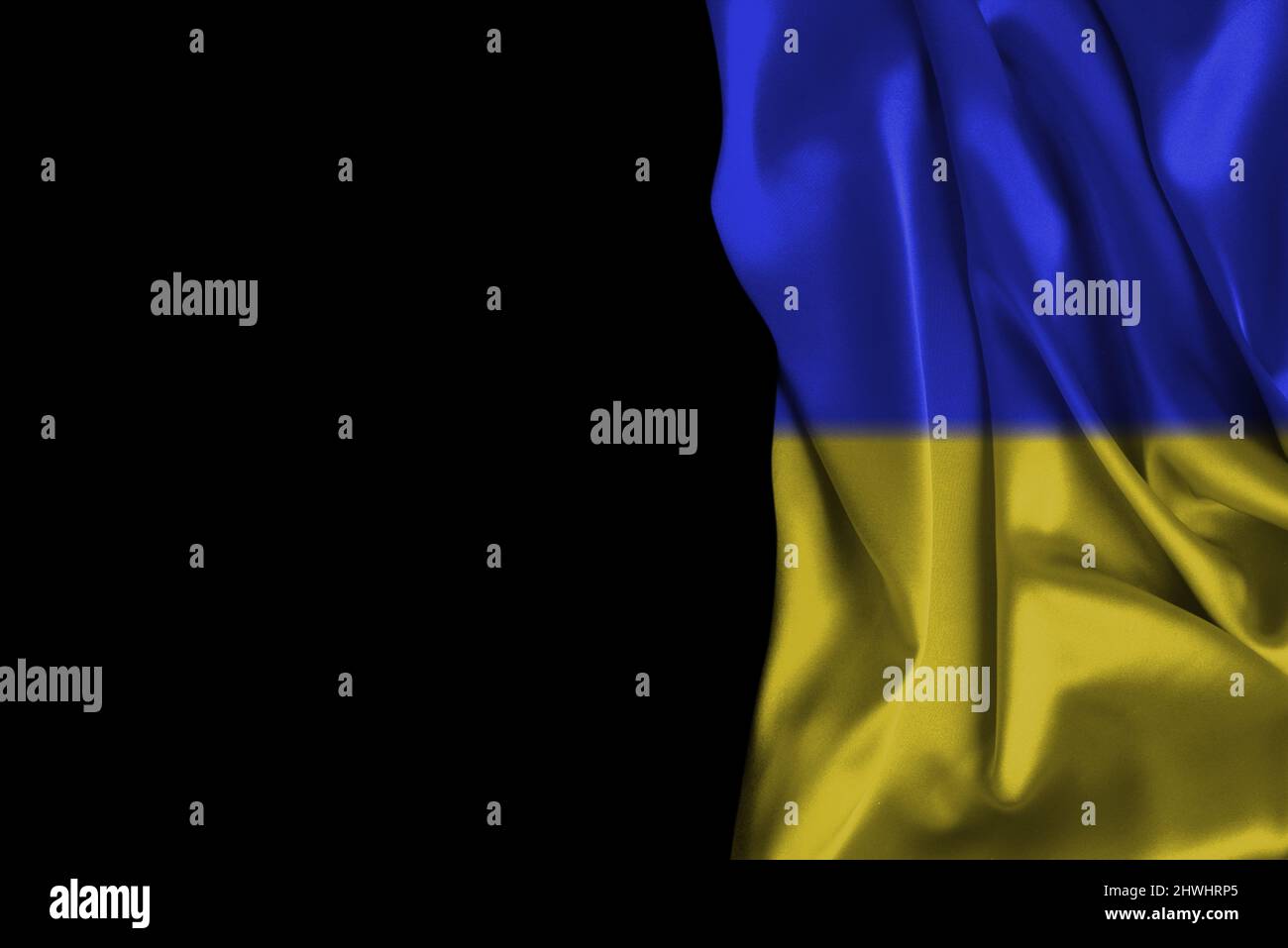 Ukrainian flag isolated on a black background. Copy space. Stock Photo
