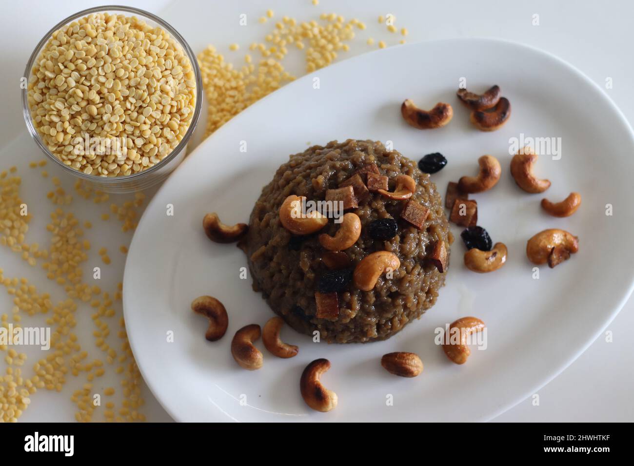 Sweet Pongal. An Indian sweet dish made of white rice and yellow moong lentils and jaggery. Garnished with ghee fried cashews nuts and coconut bits. S Stock Photo