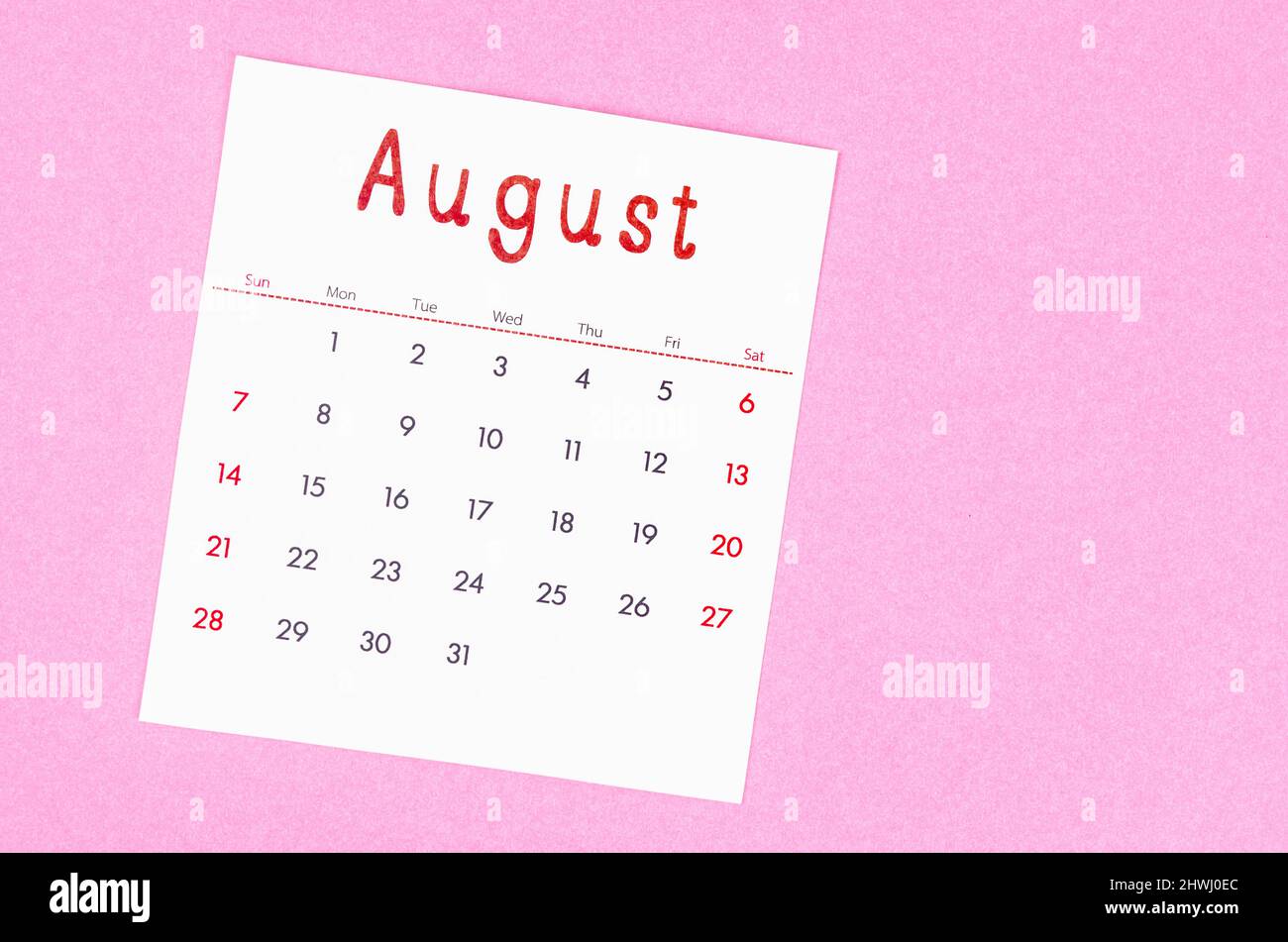 The August 2022 calendar on pink background with empty space. Stock Photo