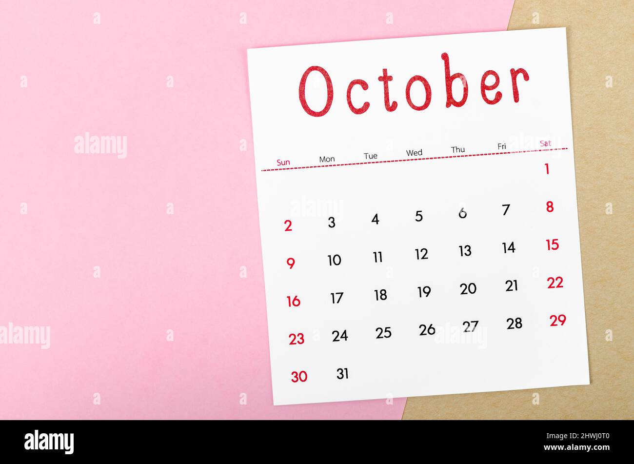 The October 2022 calendar on pink background with empty space. Stock Photo
