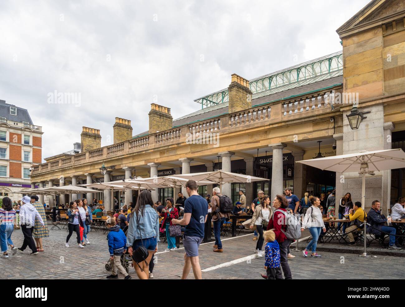 Tourists visiting Covent Garden, London, UK Stock Photo