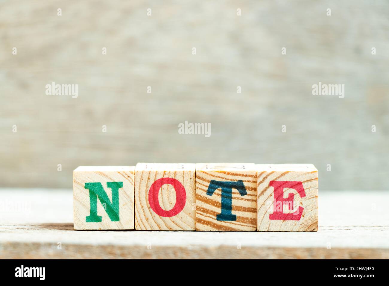 Alphabet letter block in word note on wood background Stock Photo - Alamy
