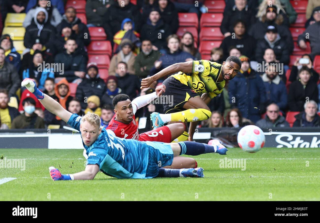 Watford, UK. 6th Mar, 2022. Emmanuel Dennis of Watford scores in the first minute of the game past Aaron Ramsdale of Arsenal lbefore it is ruled out for offside during the Premier League match at Vicarage Road, Watford. Picture credit should read: David Klein/Sportimage Credit: Sportimage/Alamy Live News Stock Photo