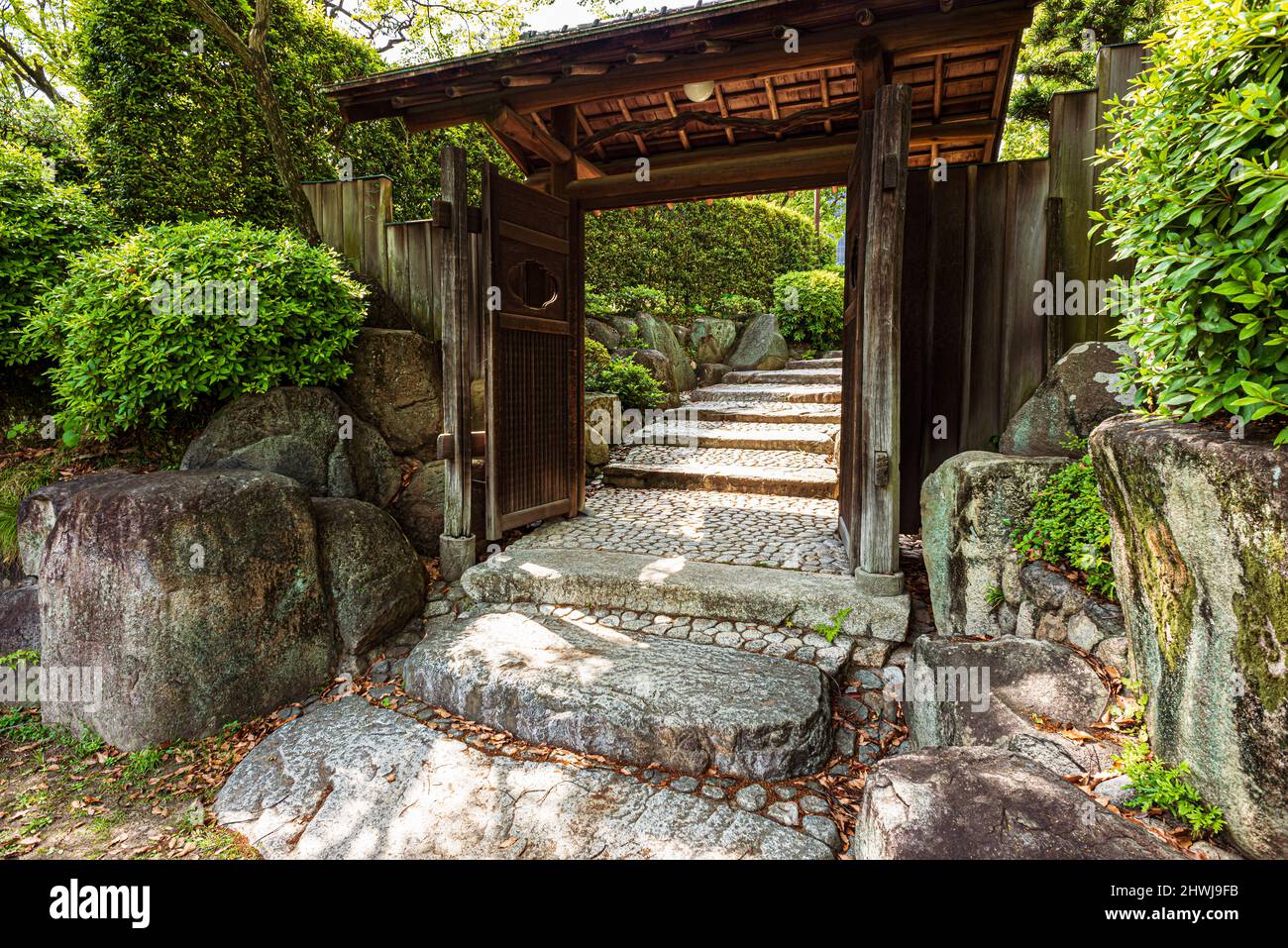 Gateway on a path in the Sorakuen Gardens, in Kobe, Japan. Stock Photo