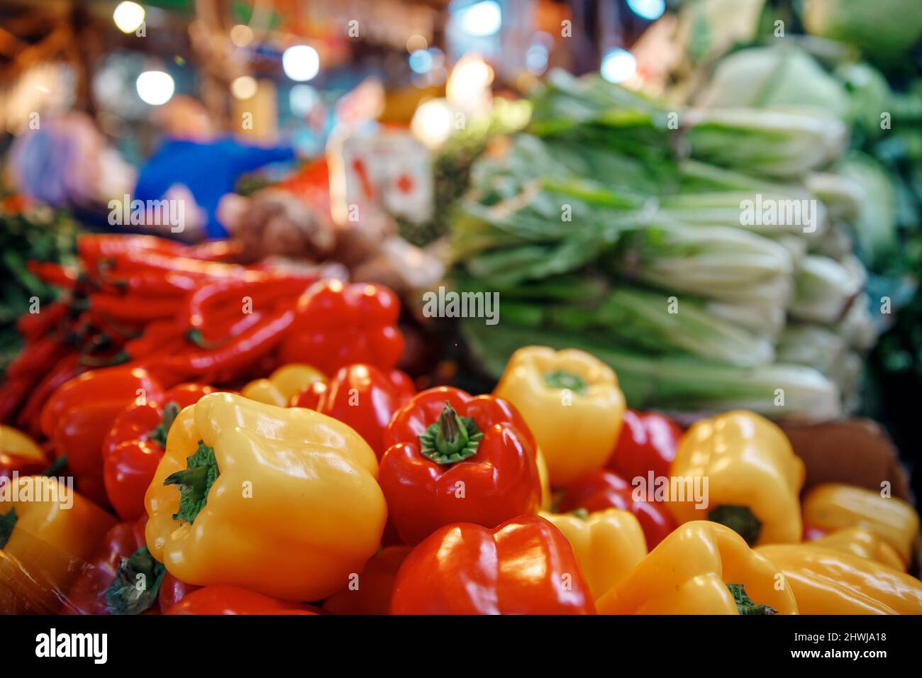 Red and yellow sweet paprika peppers on bazaar counter in Egypt. Farm products concept. Stock Photo