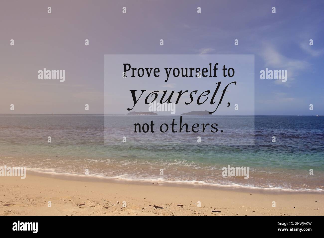 Motivational and inspirational quote on blurred background of blue ocean Prove yourself to