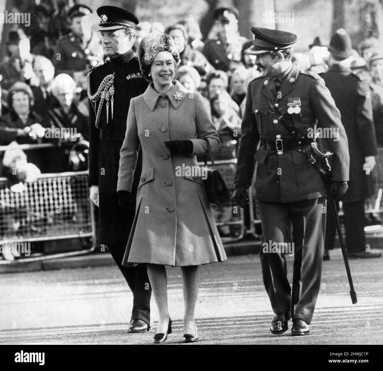 Queen Elizabeth II walks towards the dais to receive the salute of the Guard of Honour of the 3rd Battalion Royal Regiment of Wales, with Colonel B.M Pim, Commander of the Cardiff Garrison. 19th November 1971. Stock Photo