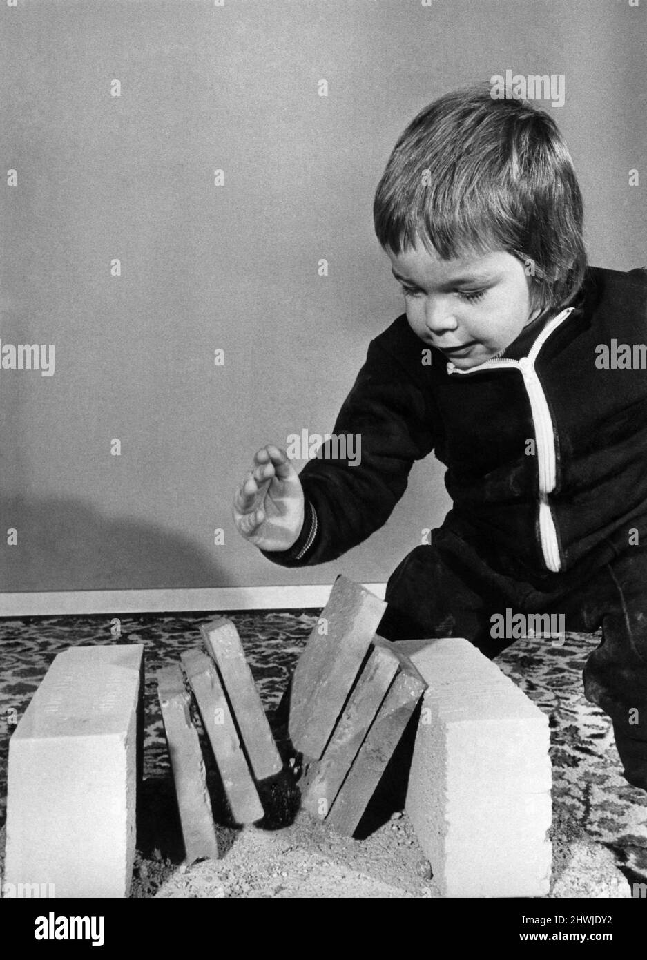 Supertot Preston Mahon shatters three bricks with a hefty blow, at the tender age of two-and-a-half he's well on his way to becoming a Karate Black Belt November 1973 *** Local Caption *** Children: Sports: Karate: Stock Photo