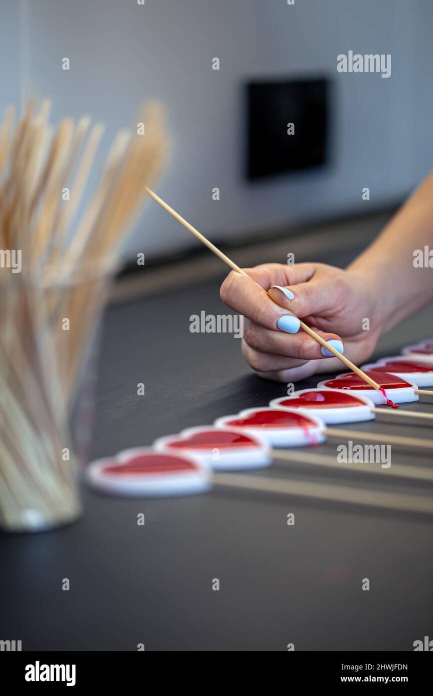 Closeup, the process of making lollipops from natural ingredients