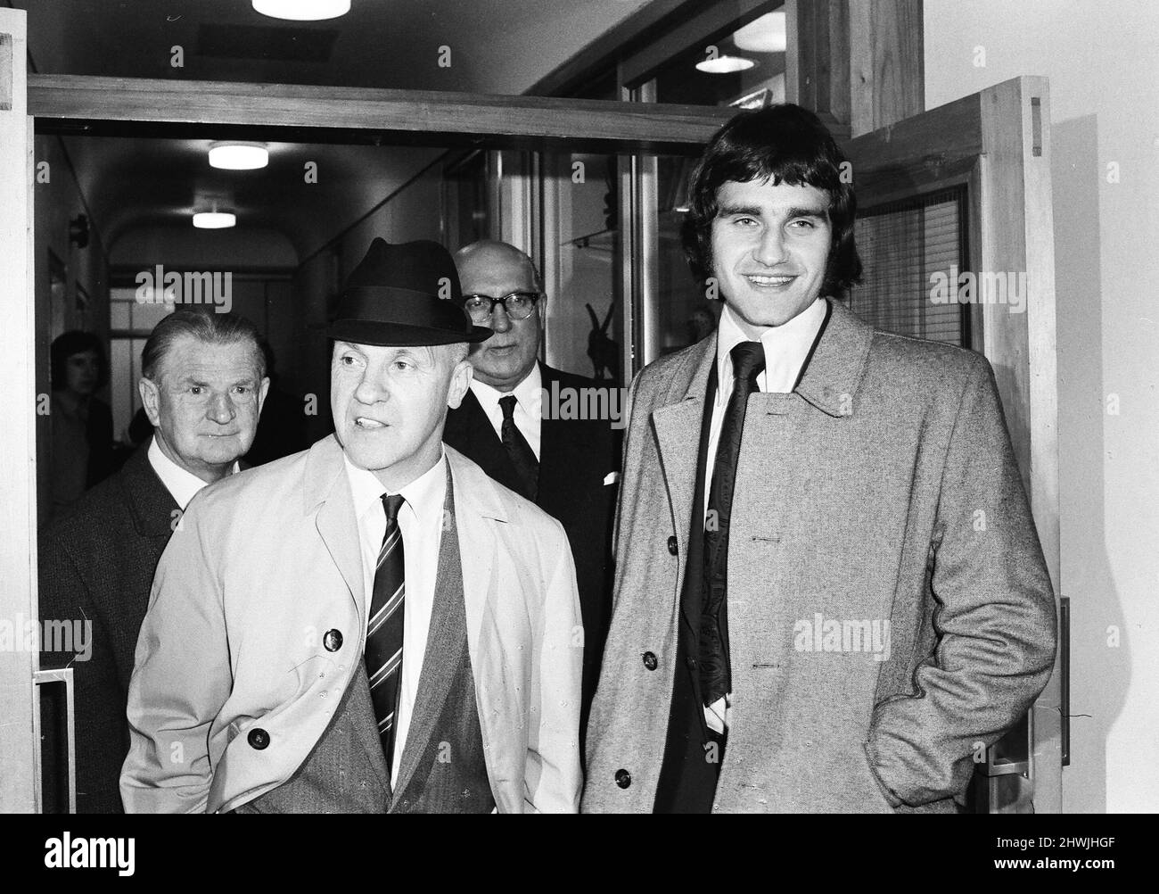 Larry Lloyd Liverpool centre half smiles as he leaves FA Headquarters at Lancaster Gate with manager Bill Shankly, after hearing good news from the disciplinary committee November 1972. Stock Photo