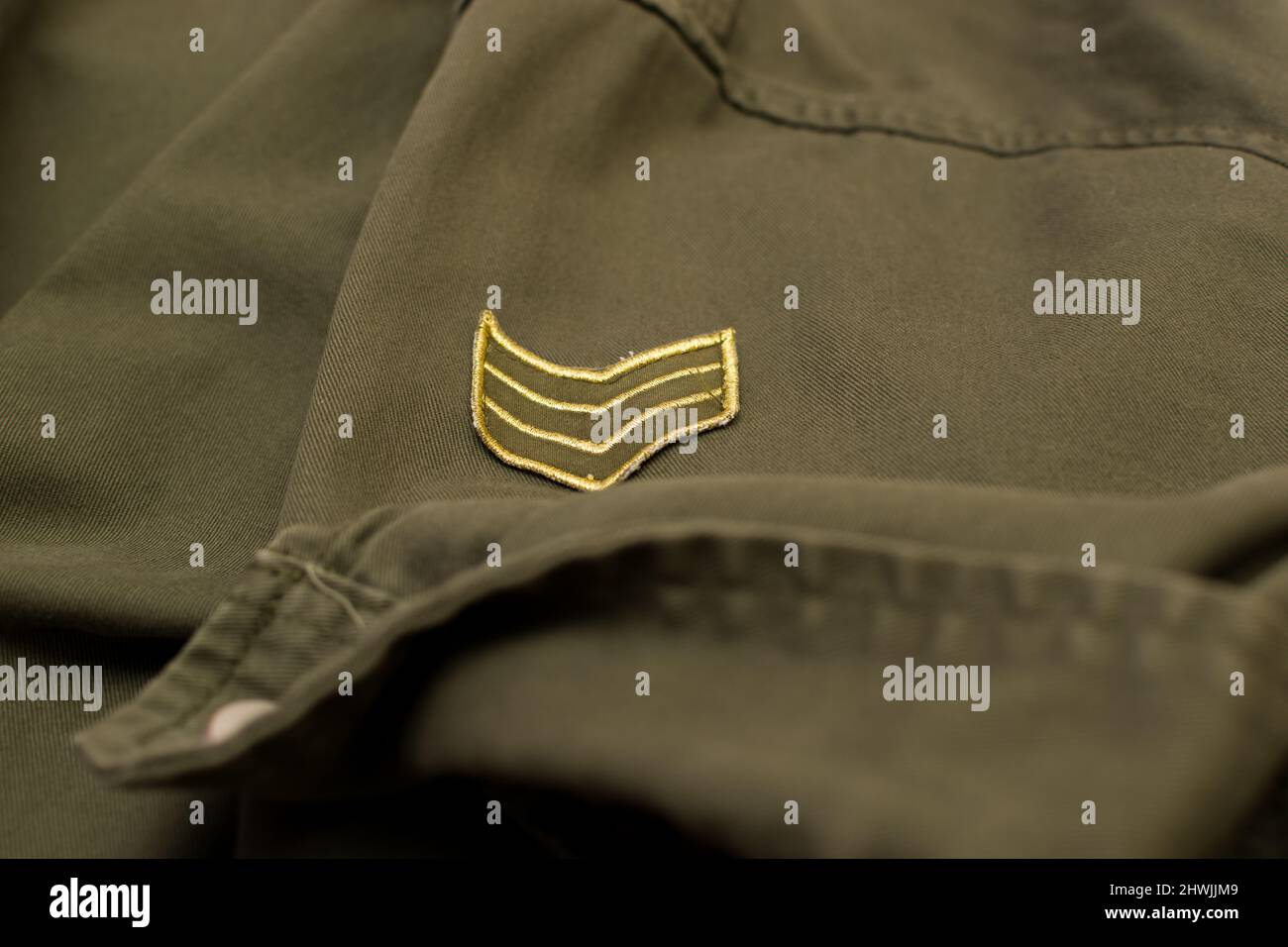 Olive green military uniform with military rank, close up Stock Photo