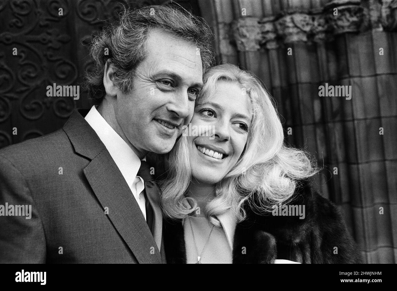 Granada TV star Julie Goodyear, 30, who plays the barmaid in the Rovers Return in 'Coronation Street' is pictured with her husband-to-be Tony Rudman, 42, at Bury Parish Church where they will wed. 18th February 1973. Stock Photo