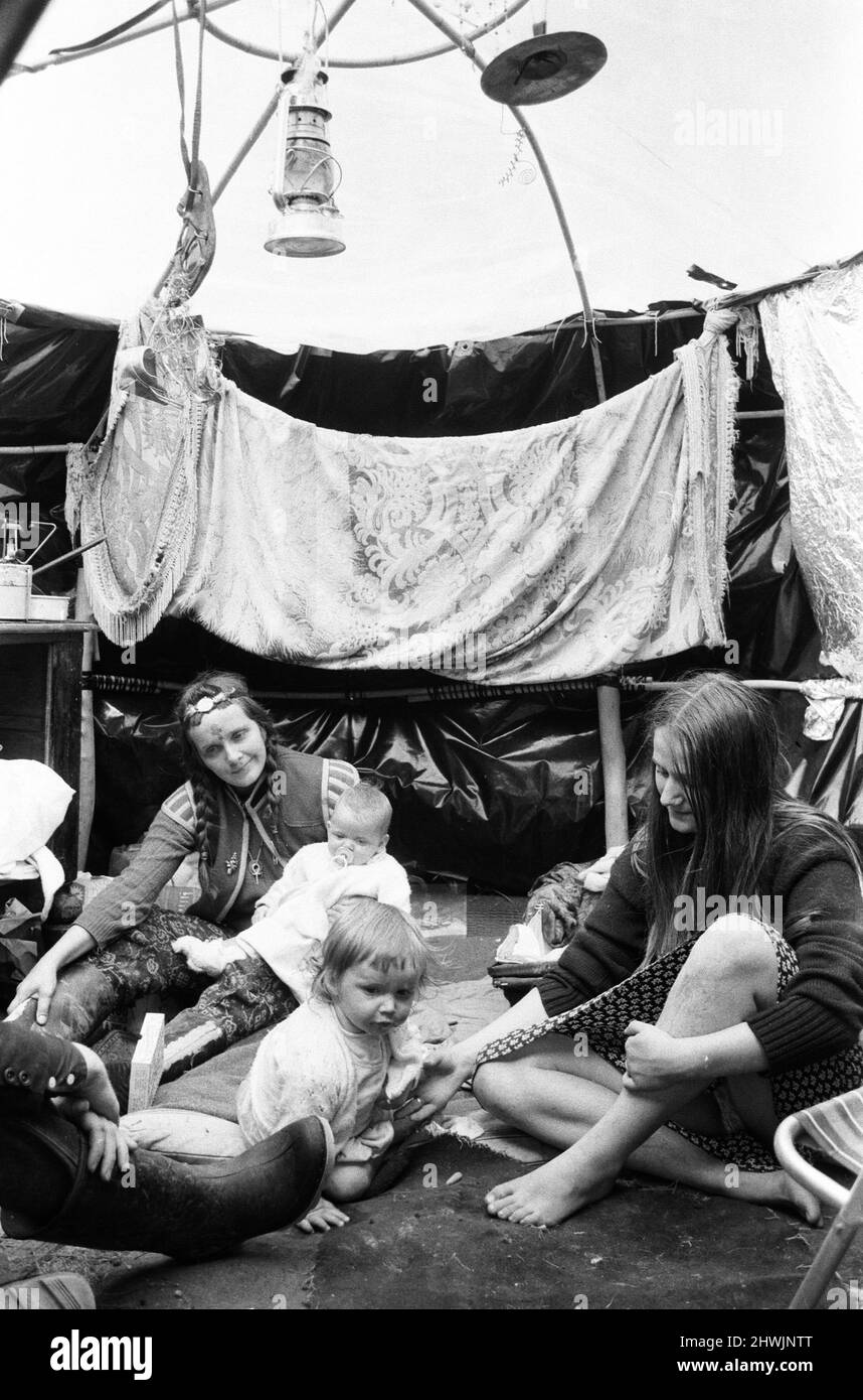 The Glastonbury Fayre of 1971, a free festival planned by Andrew Kerr and Arabella Churchill .Picture shows: Hippies inside their rain igloo at the festival the day before the opening. 19th June 1971. Stock Photo
