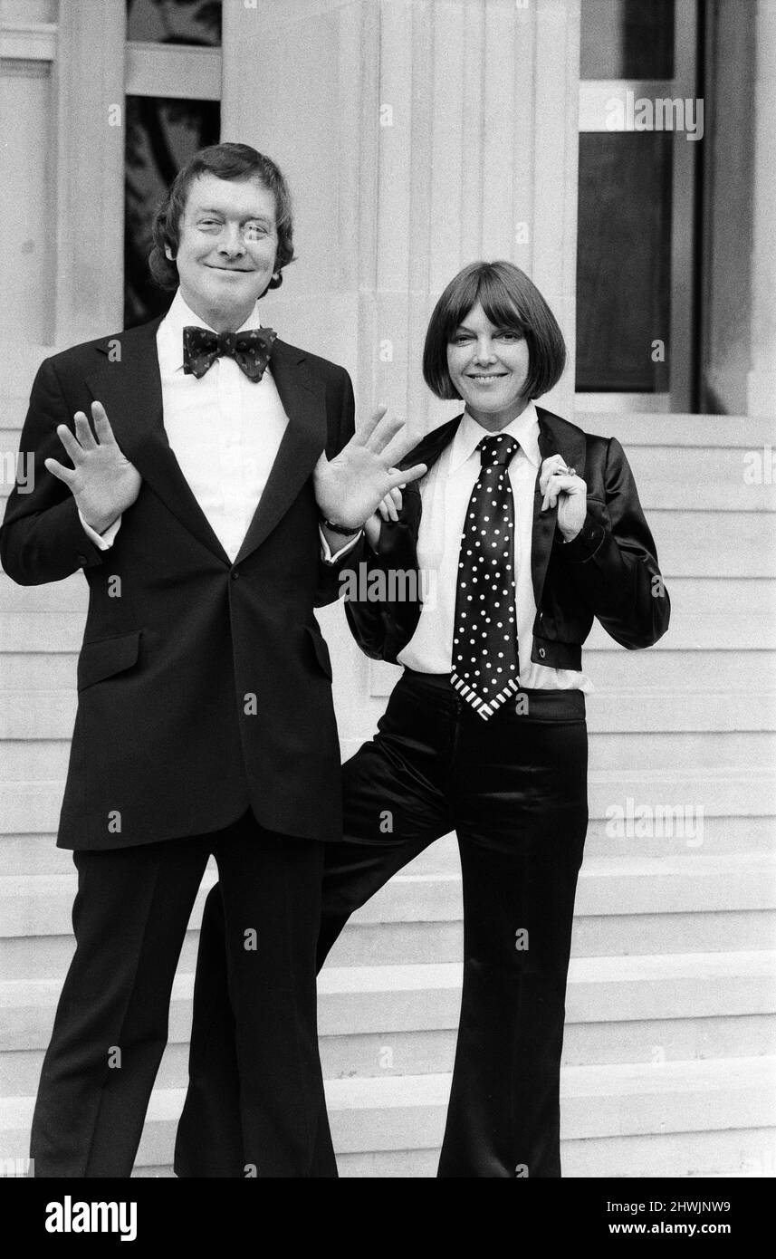 Mary Quant launched her new range of neckwear at the Savoy Hotel in London. It is the first time she has designed for men and the collection includes ties and bow ties in unusual fabrics and colours. Mary Quant is pictured with her husband Alexander Plunket Greene wearing the new designs. 12th September 1972. Stock Photo